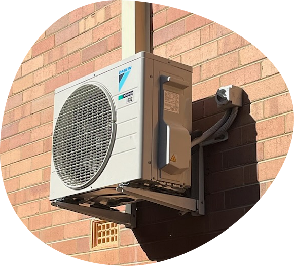 daikin air conditioner outdoor unit installed on brick wall