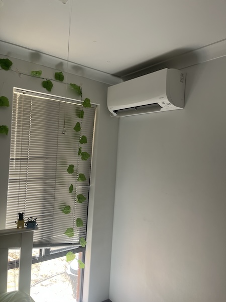 side entry split system ac in bedroom on side wall